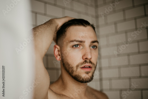 Young Male Model Washing Hair in Trendy Subway Tile Wet Shower 