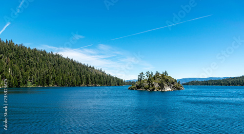 Lake Tahoe is a large freshwater lake in the Sierra Nevada of the United States. It straddles the state line between California and Nevada, west of Carson City. 