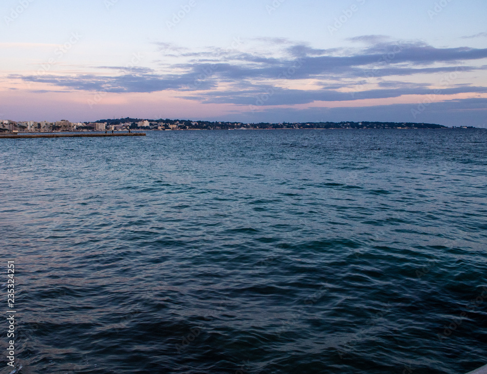 Mediterranean sea and Antibes Cape at dusk