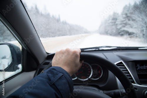 Driving a car on a winter road