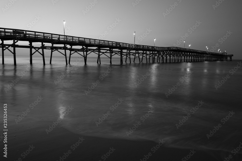 Black and White pier at sunrise
