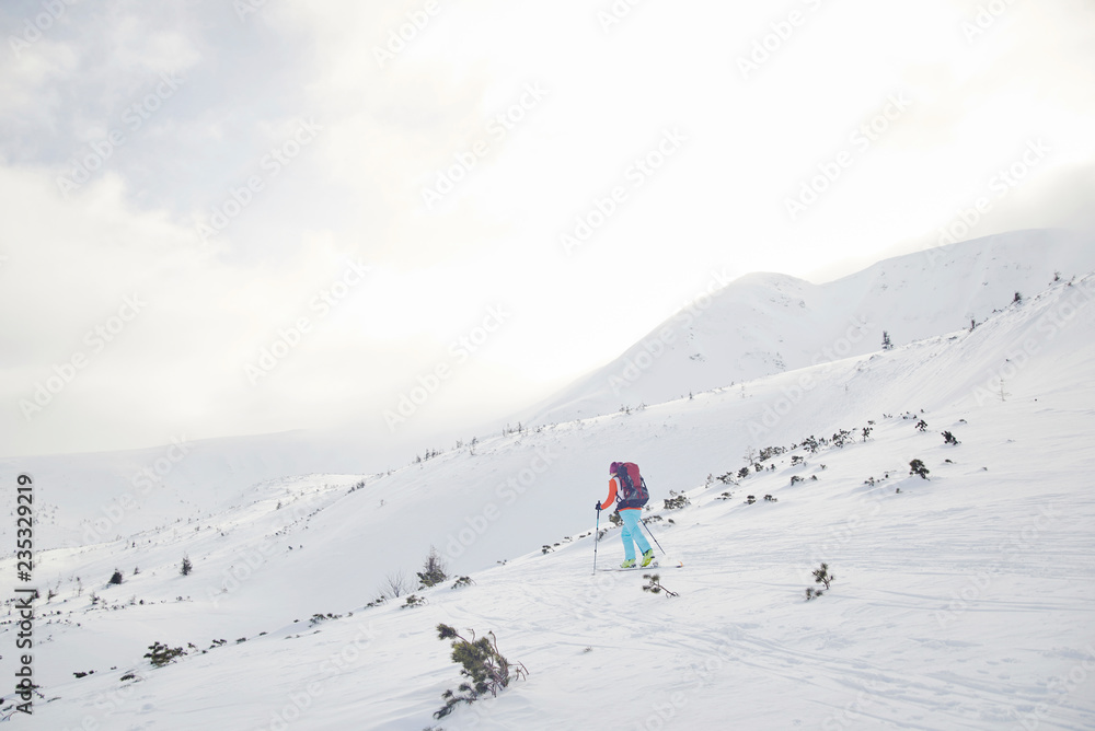 Skitouring with amazing view of mountains in beautiful winter powder snow