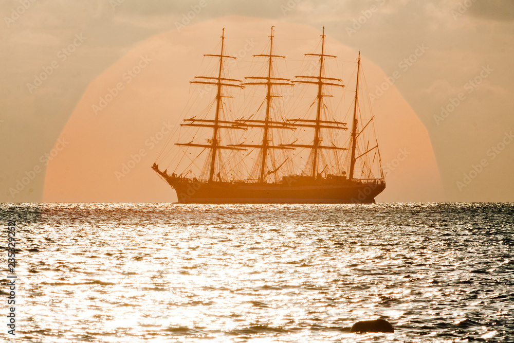 Sailing vessel at sunset