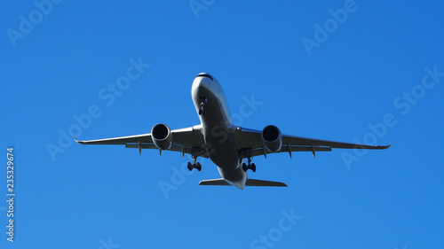 landing plane with blue sky
