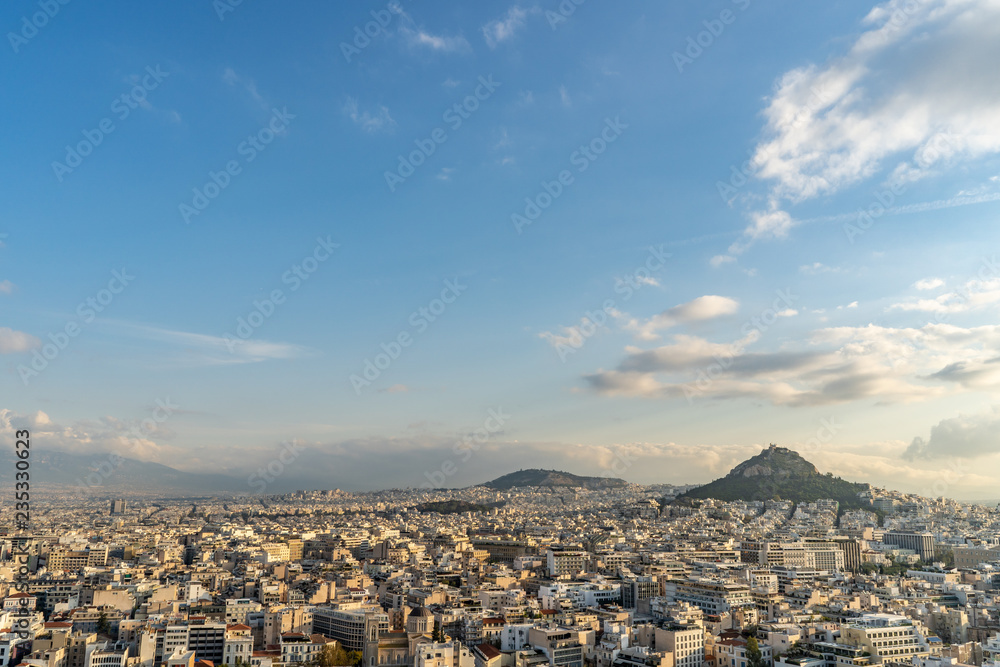Cityscape wide angle view of the beautiful city of Athens, with Mount Lycabettus in the distance. 