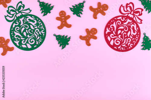 New Year composition with pine tree and gingerbread man. Christmas concept background. Flat lay, top view of festive still life