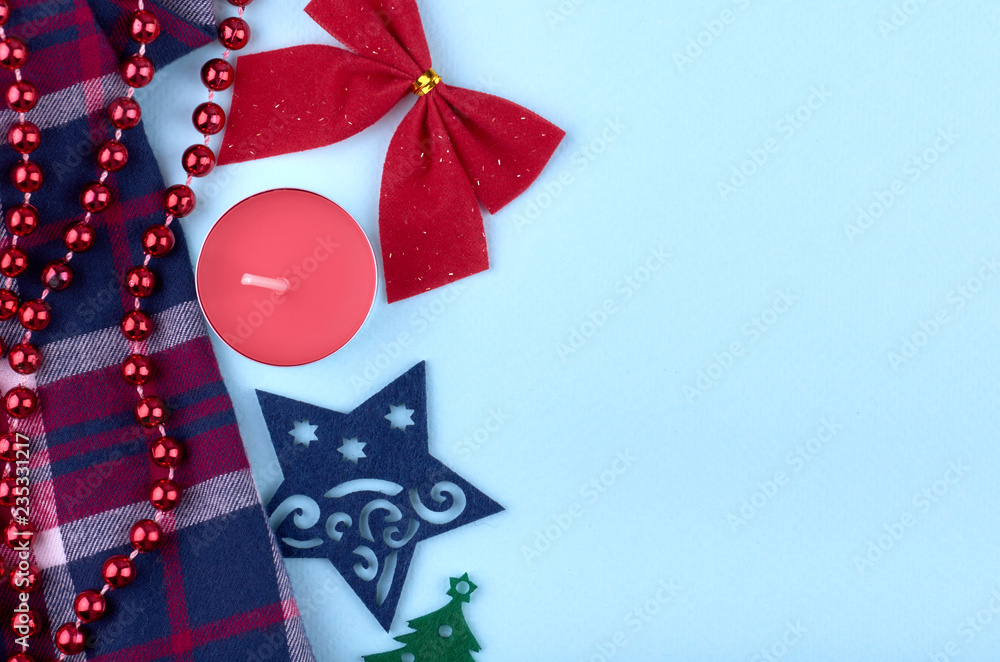 New Year composition with candles, star, cotton textile, ribbon and beads. Christmas concept background. Flat lay, top view of festive still life New Year composition with candles, star, cotton textile, ribbon and beads. Christmas concept background. Flat lay, top view of festive still life