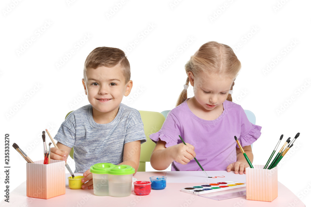 Cute children painting picture at table on white background Cute children painting picture at table on white background