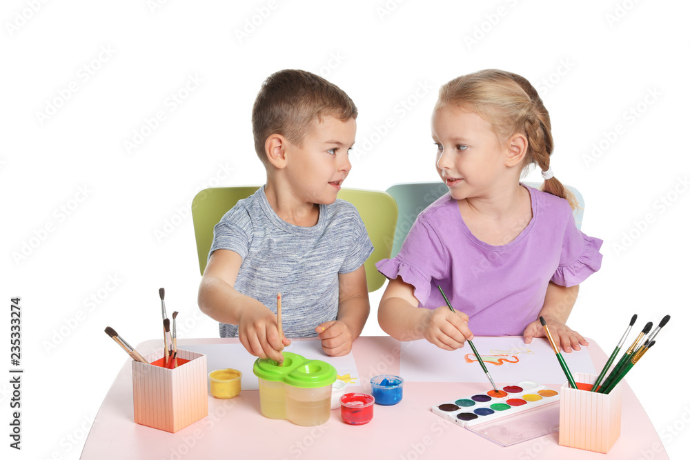 Cute children painting picture at table on white background Cute children painting picture at table on white background