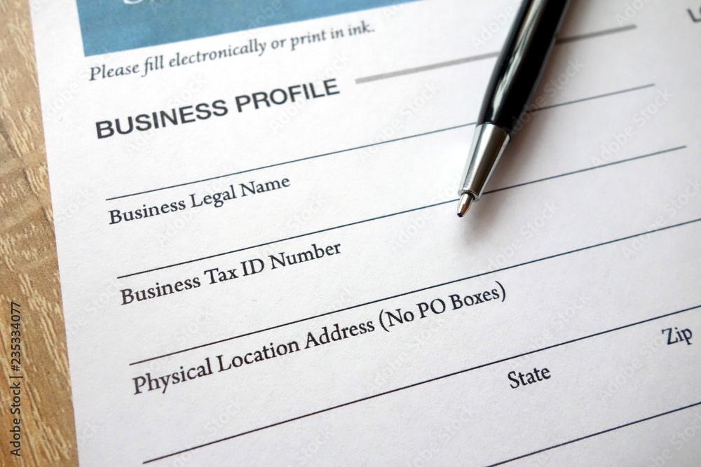 Business profile heading on loan application form and pen Business profile heading on loan application form and pen