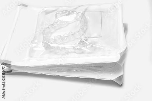 invisible braces aligner in packages, Dental orthodontic silicone trainer Mobile orthodontic appliance for dental correction.