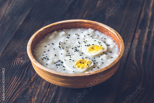 Bowl of congee - Asian rice porridge photo