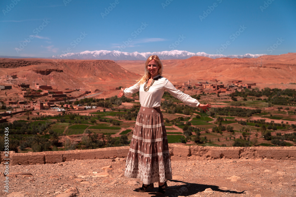Girl in front of the panoramic view of the High Atlas Mountains