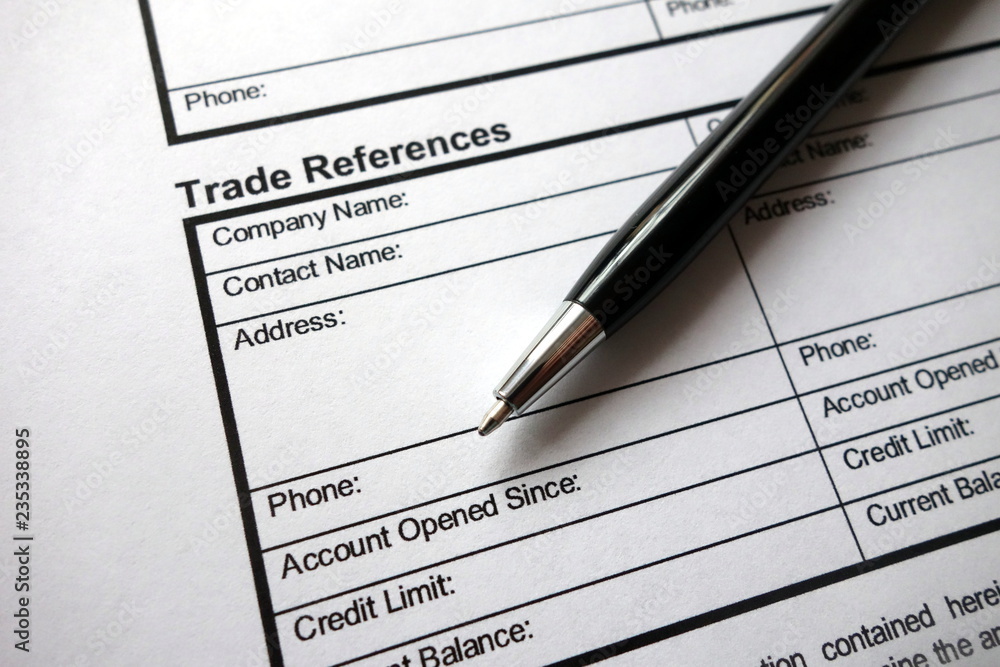 Trade references heading on business credit application form with pen Trade references heading on business credit application form with pen