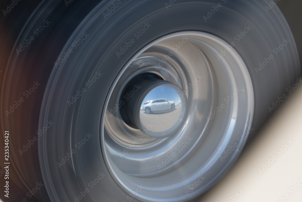 reflection of a truck on a wheel reflection of a truck on a wheel
