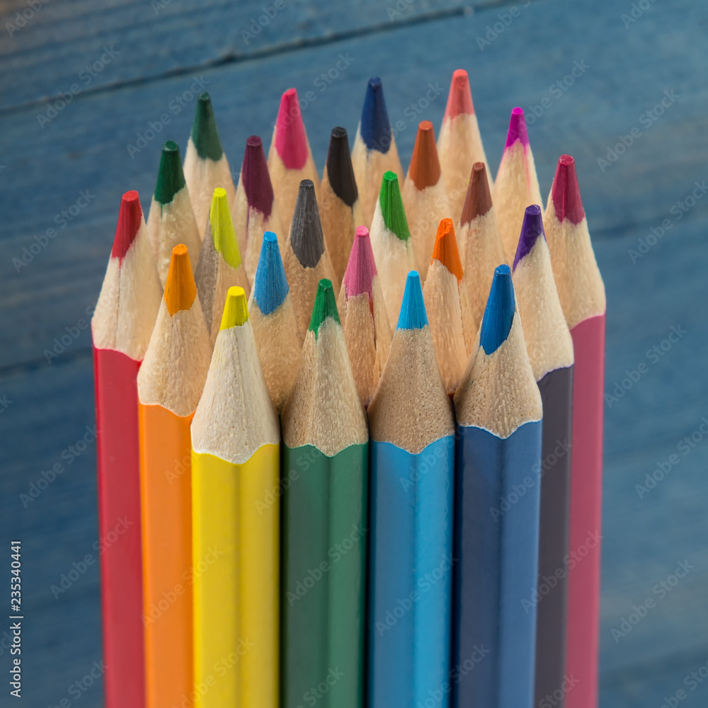 Group of color pencils on blue background Group of color pencils on blue background