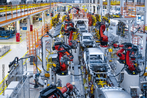 Automotive production line. Welding car body. Modern car Assembly plant photo