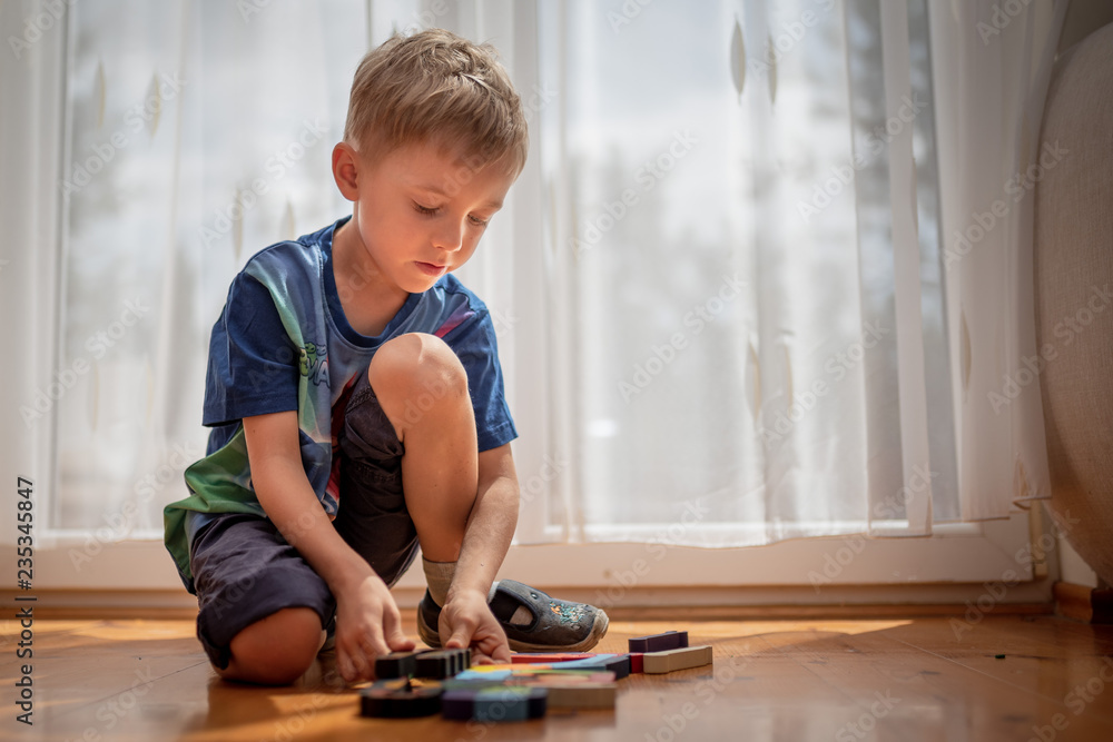 5-6 old boy play with blocks puzzle 5-6 old boy play with blocks puzzle