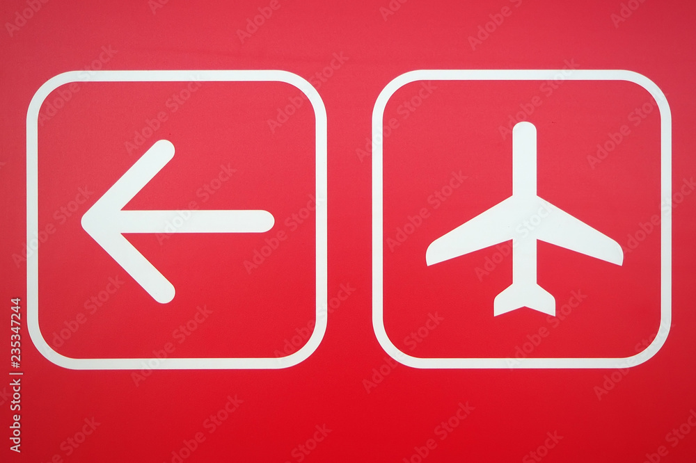 arrow and airplane navigation symbol on red background arrow and airplane navigation symbol on red background