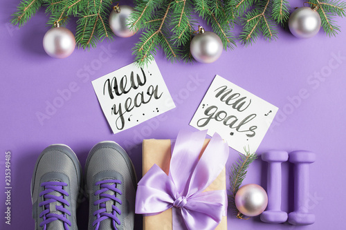 Christmas sport composition dumbbells sneakers branches concept healthy lifestyle