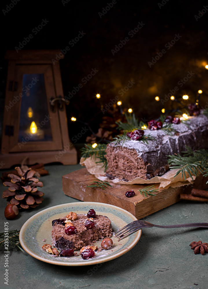 Fotografie Chocolate swiss roll cake roulade with nuts