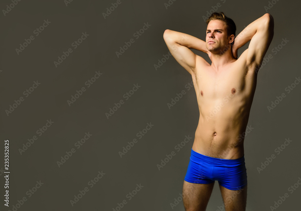 Sexy fitness model in underwear. Fashion model. Muscular male model in underwear. Handsome muscular man in blue boxer shorts. Sexy handsome man in underwear. Strong athletic man with muscular torso. Sexy fitness model in underwear. Fashion model. Muscular male model in underwear. Handsome muscular man in blue boxer shorts. Sexy handsome man in underwear. Strong athletic man with muscular torso.