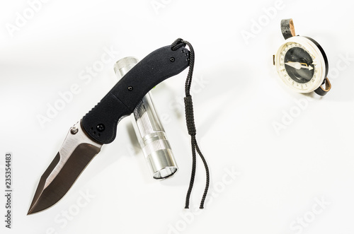 Knife flashlight and compass. Tourist set. Pathfinder set. photo