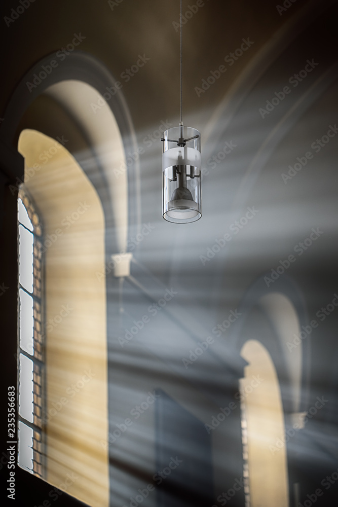 Light rays shines through the arched window Light rays shines through the arched window