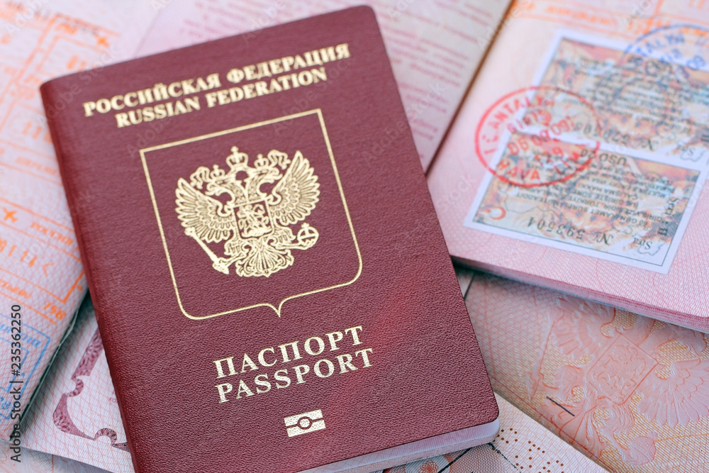 Russian passports and visa immigration stamps. Background of documents Russian passports and visa immigration stamps. Background of documents