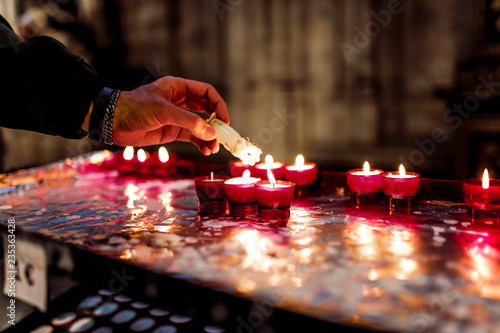 Brussels, Kingdom of Belgium. Light a candle in the church. 