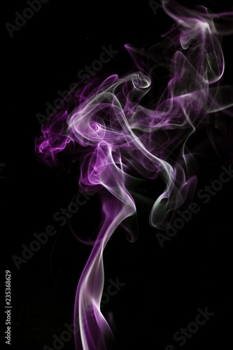 Two color smoke isolated on black background