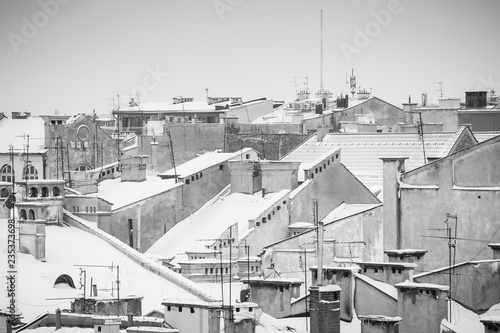 Krakow in Christmas time, aerial view on snowy roofs in central part of city. BW photo. Poland. Europe.