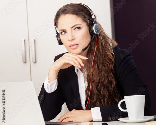 young business woman with headset e-learning call-center freindly support photo