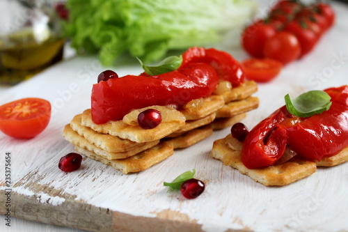 Healthy sandwiches with stuffed pepper and pomegranate on crusp bread. Top view. photo