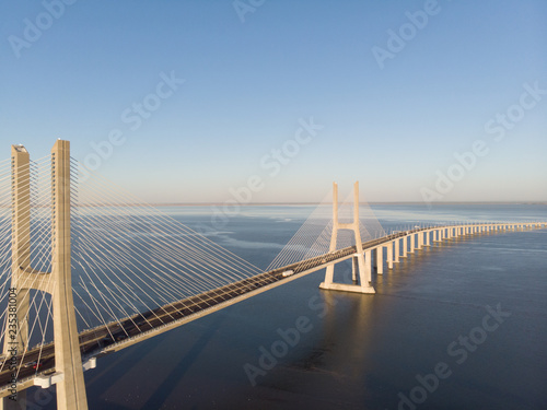 Vasco da Gama Bridge landscape at sunrise. One of the longest bridges in the world. Lisbon is an amazing tourist destination because its light, its monuments. Portugal landmark.