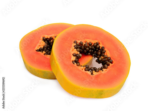 two sliced ripe papaya with seeds isolated on white background