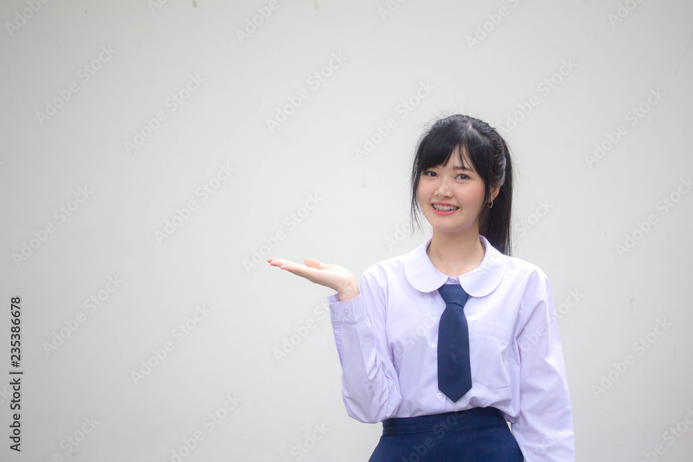 Portrait of thai high school student uniform beautiful girl show hand Portrait of thai high school student uniform beautiful girl show hand