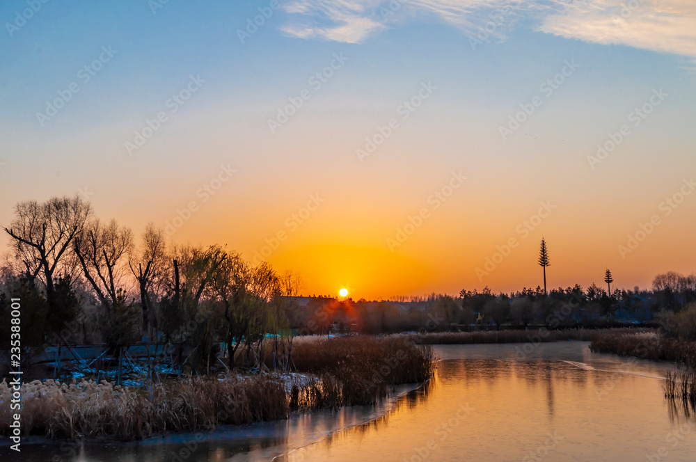 Sunset and frozen river - Changchun Beihu National Wetland Park, China