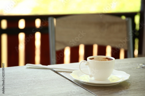 Fototapeta Naklejka Na Ścianę i Meble -  Used coffee cup put on the top of table.