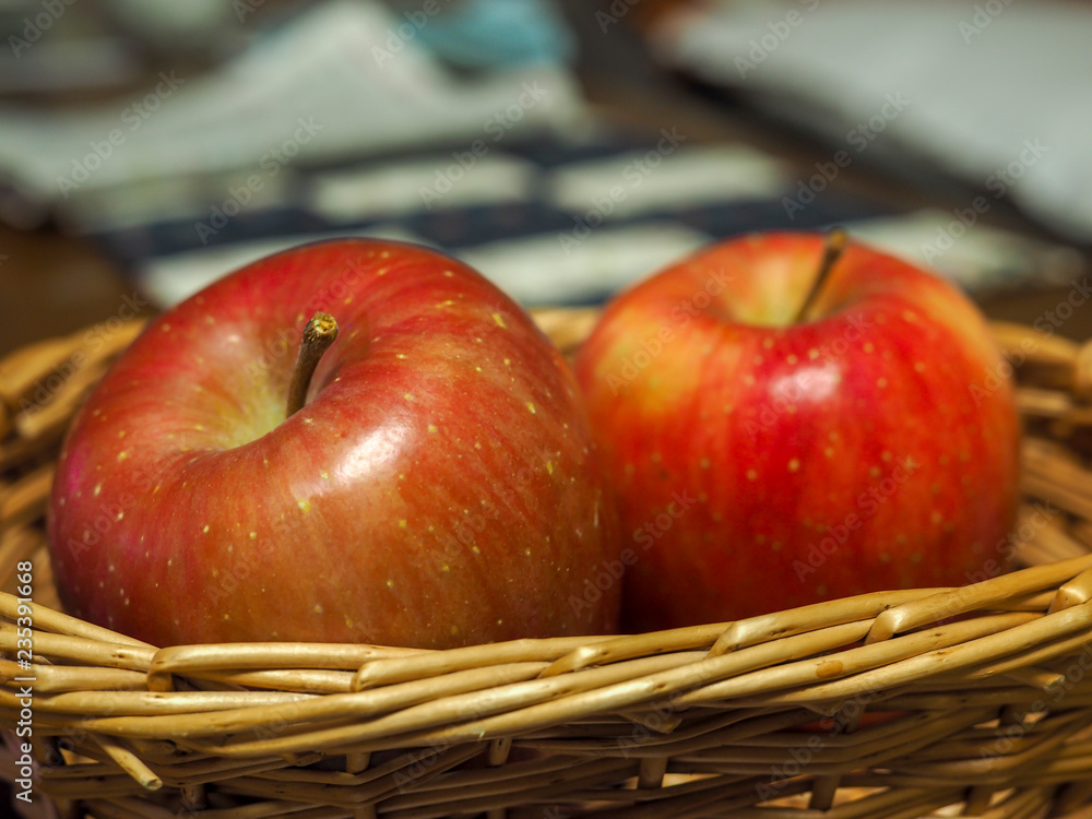 Two apples in basket. Stock Photo | Adobe Stock