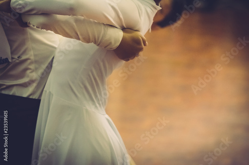 Motion blur of couple dancers dance on the floor