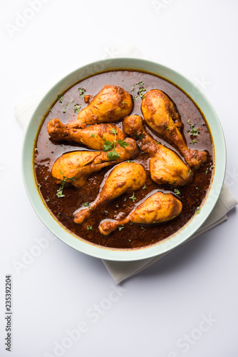 Chicken leg / drumstick curry or Murg Tangri/tangdi masala. Served in a bowl over moody background. Selective focus © Arundhati