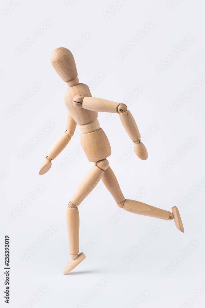 running wooden mannequin isolated on white background running wooden mannequin isolated on white background