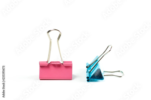 Stationery metallic colored binder clips. Close up. Isolated on white background.
