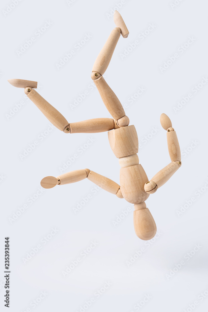 falling wooden mannequin isolated on white background falling wooden mannequin isolated on white background