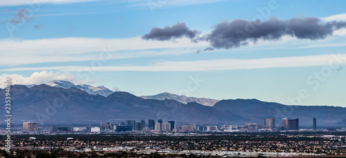 Las vegas city surrounded by red rock mountains and valley of fire