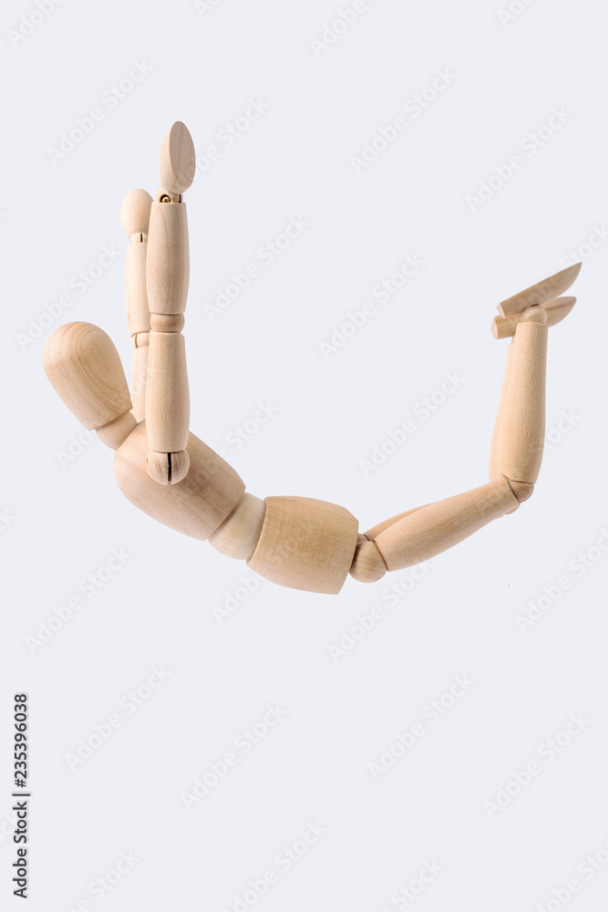 free falling wooden mannequin isolated on white Stock Photo