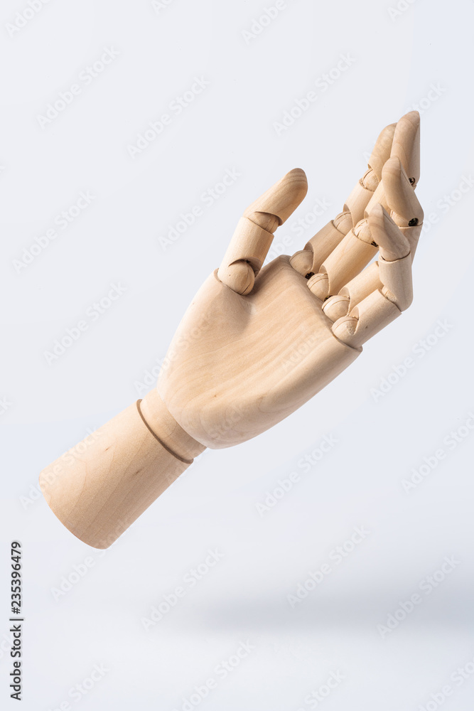 wooden raise hand with gesture isolated on white wooden raise hand with gesture isolated on white
