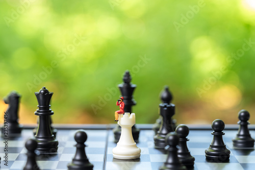 Miniature people businessmen sitting on Chess Analysis Communicate about business strategy. Or business planning using as background business concept and Strategy concept with copy space for your text