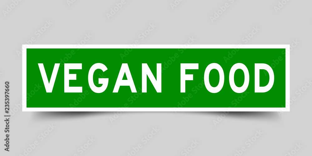 Square green sticker label in word vegan food on gray background